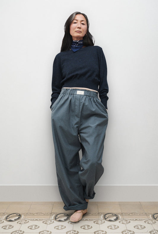 Image of a model wearing Pants. Product name - Cotton Silk Paper Bag Pants Slate in Slate colour by brand - Silk Laundry