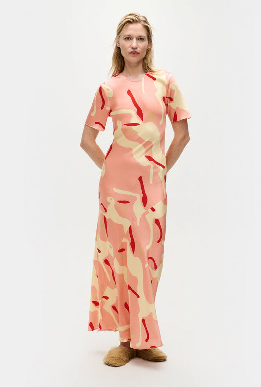 Image of a model wearing Tops. Product name - Short Sleeve Bias Dress Rabbit Amaranth in Rabbit Amaranth colour by brand - Silk Laundry