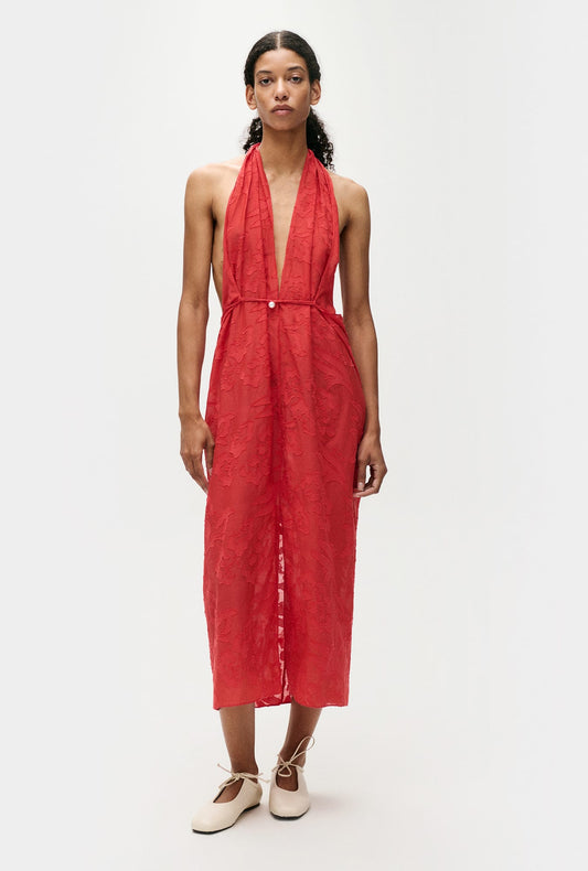 Image of a model wearing Skirts. Product name - Clip Silk Wrap Skirt Geranium in Geranium colour by brand - Silk Laundry