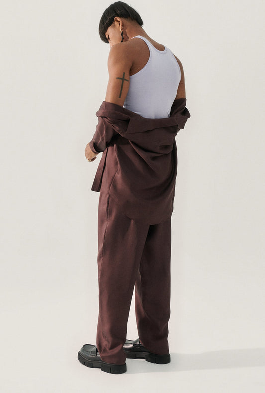 Image of a model wearing Tops. Product name - Jersey Tank Lavender in Lavender colour by brand - Silk Laundry