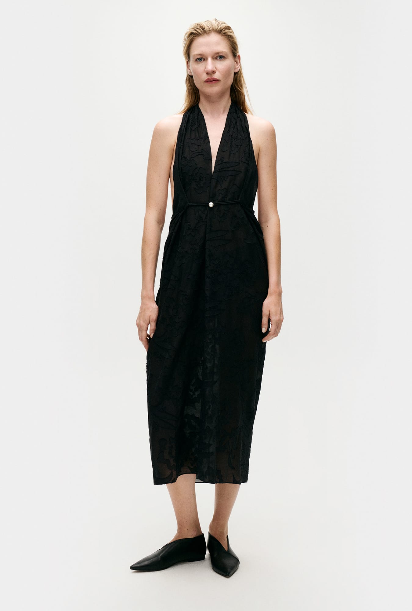 Image of a model wearing Skirts. Productname: Silk Laundry CLIP SILK WRAP SKIRT in Tulipa Black colour by brand - Silk Laundry