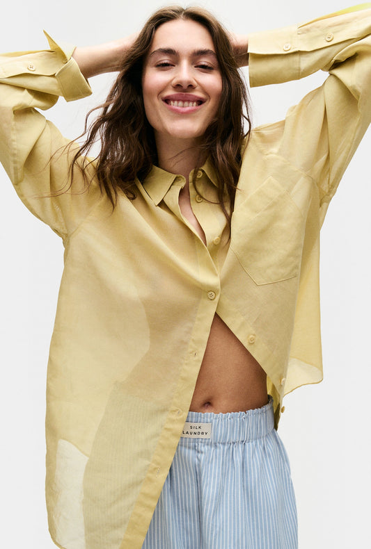 Image of a model wearing Tops. Productname: Silk Laundry Sheer Cotton Pleated Yoke Shirt in Shell colour by brand - Silk Laundry