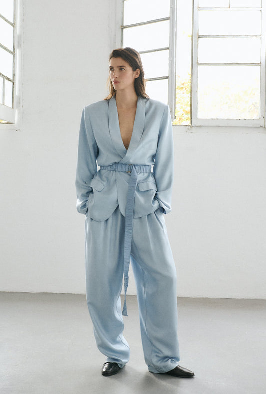 Image of a model wearing Outerwear. Productname: Twill Miami Blazer Sky in Sky colour by brand - Silk Laundry