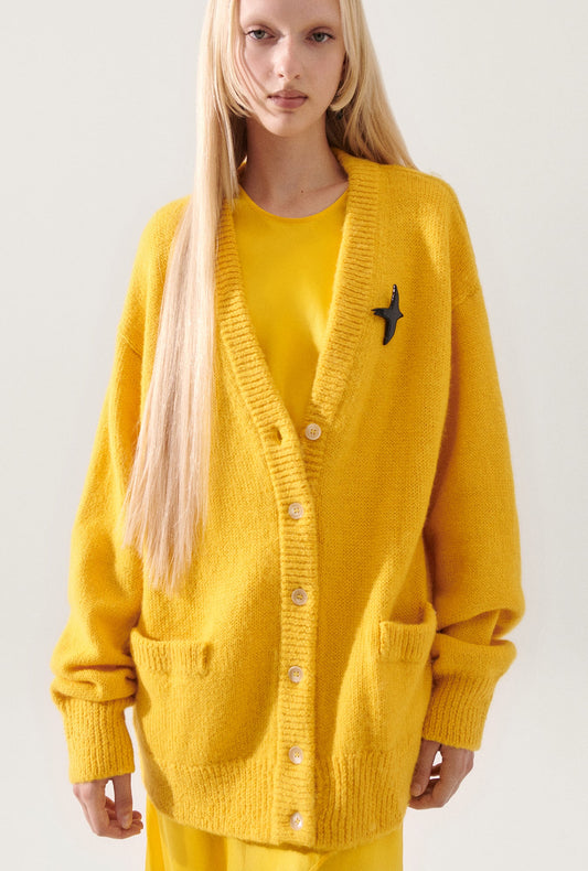 Image of a model wearing Outerwear. Productname: Alpaca Slouch Cardigan Marigold in Marigold colour by brand - Silk Laundry