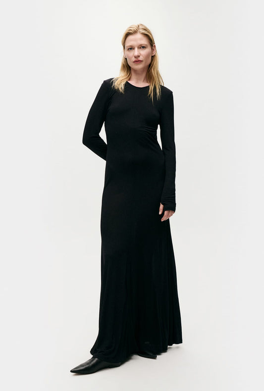 Image of a model wearing Tops. Product name - Jersey Modal Cutaway Dress Black in Black colour by brand - Silk Laundry