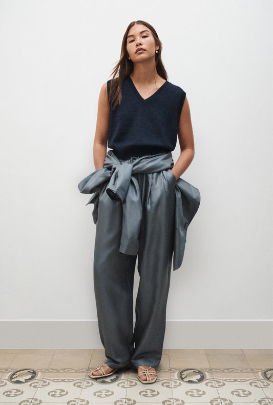 Image of a model wearing Outerwear. Product name - V-Neck Sweater Vest Azul Melange in Azul Melange colour by brand - Silk Laundry