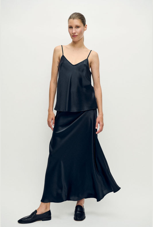 Image of a model wearing Tops. Product name - Bias Cut Cami Black in Black colour by brand - Silk Laundry
