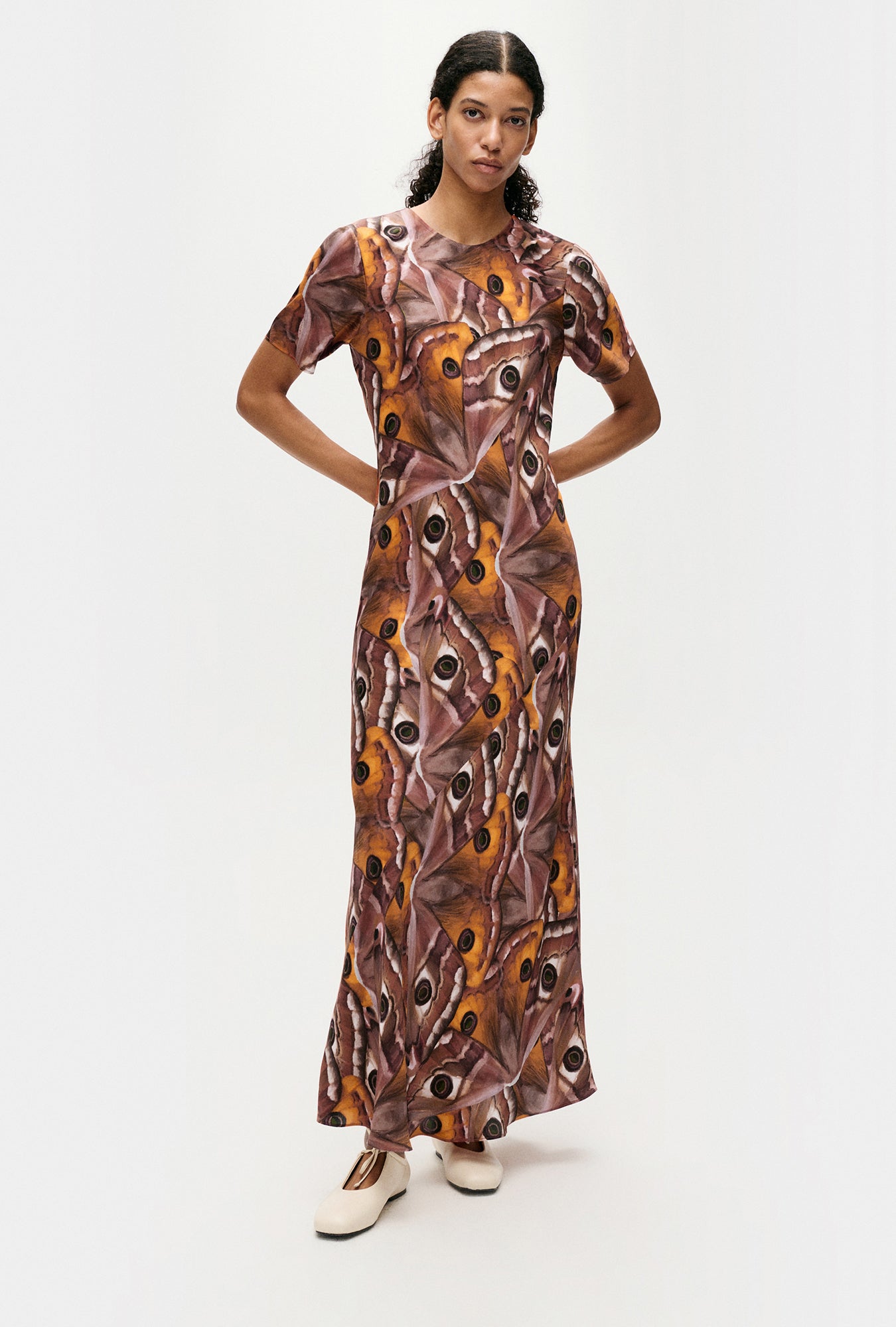 Image of a model wearing Tops. Product name - Short Sleeve Bias Dress Wingspan in Wingspan colour by brand - Silk Laundry