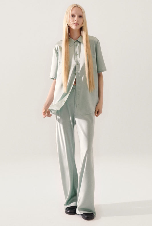 Image of a model wearing Tops. Productname: Short Sleeve Boyfriend Shirt Alabaster in Alabaster colour by brand - Silk Laundry