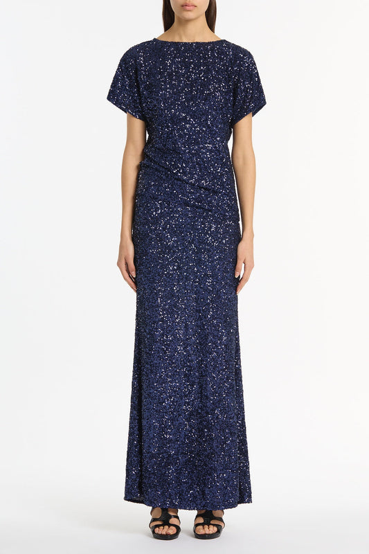 Image of a model wearing Skirts. Product name - Midnight Crushed Sequin Column Skirt in Navy colour by brand - Carla Zampatti