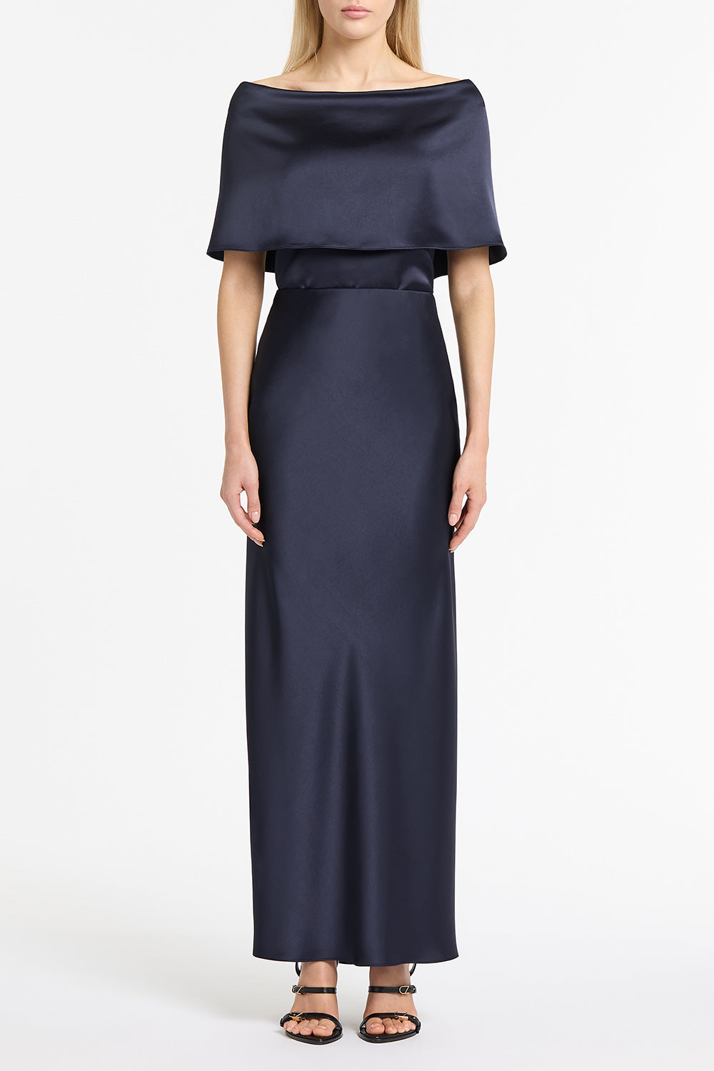 Image of a model wearing Tops. Product name - Midnight Satin Off Shoulder Top in Blue colour by brand - Carla Zampatti