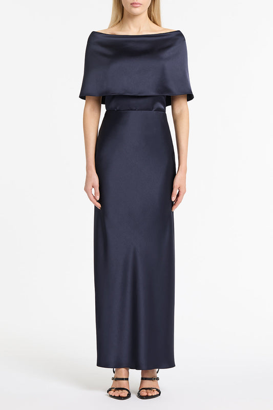 Image of a model wearing Tops. Product name - Midnight Satin Off Shoulder Top in Blue colour by brand - Carla Zampatti