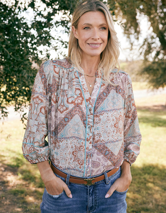 Image of a model wearing Tops. Product name - Mila Blouse Shoreline Paisley in Shoreline Paisley colour by brand - White & Co.