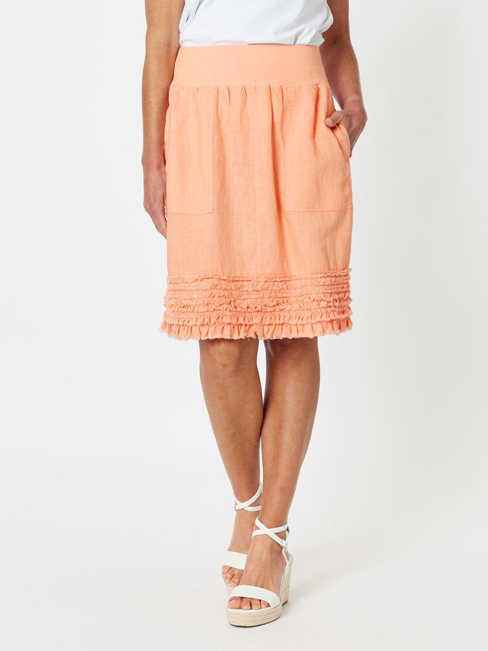 Image of a model wearing Skirts. Product name - Ruffle Hem Skirt Mandarine in Mandarine colour by brand - Gordon Smith
