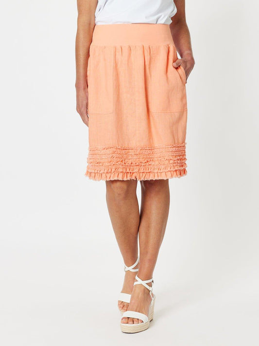 Image of a model wearing Skirts. Product name - Ruffle Hem Skirt Mandarine in Mandarine colour by brand - Gordon Smith