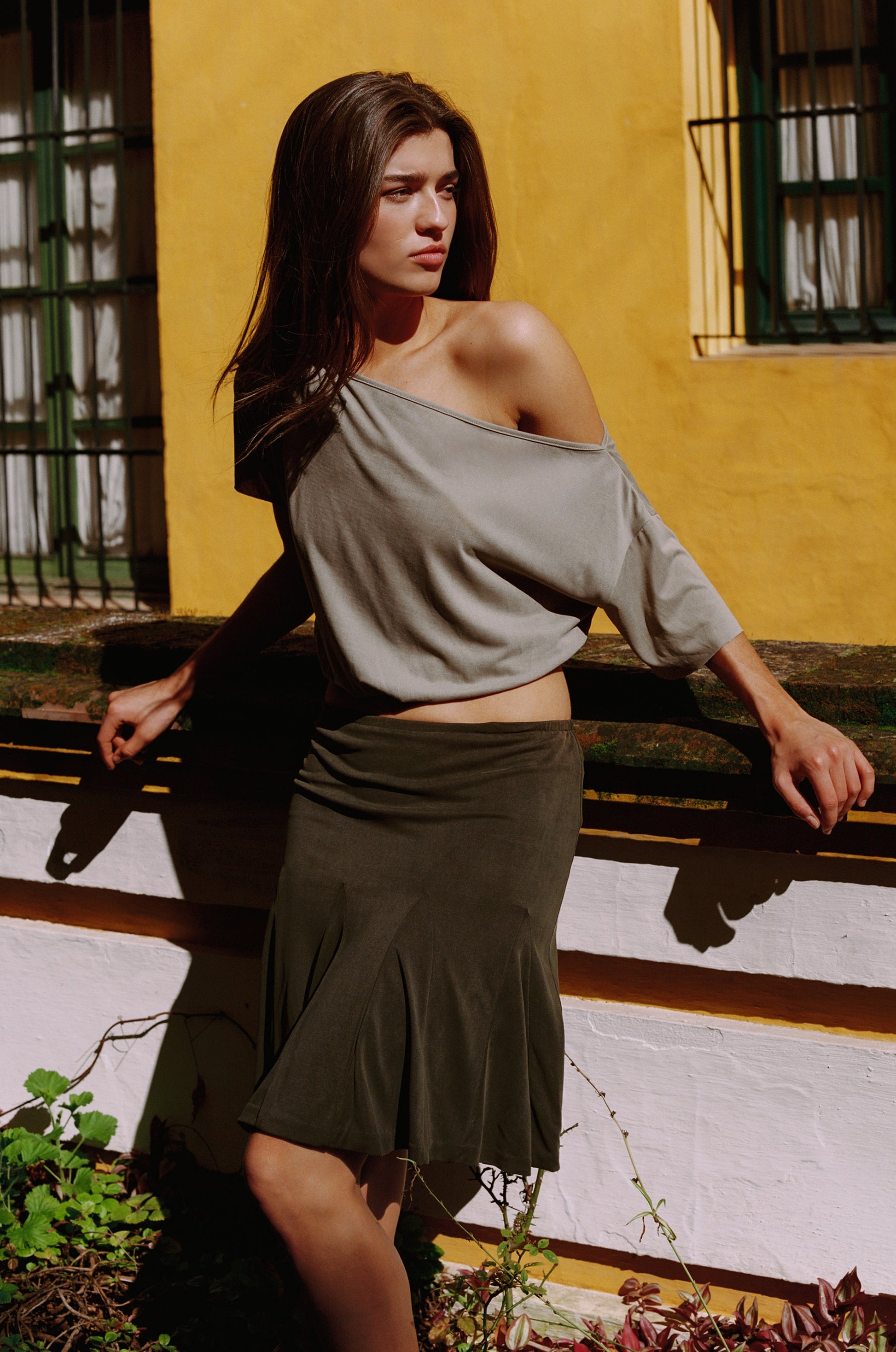 Image of a model wearing Tops. Product name - Mimi Top in Olive colour by brand - With Jéan