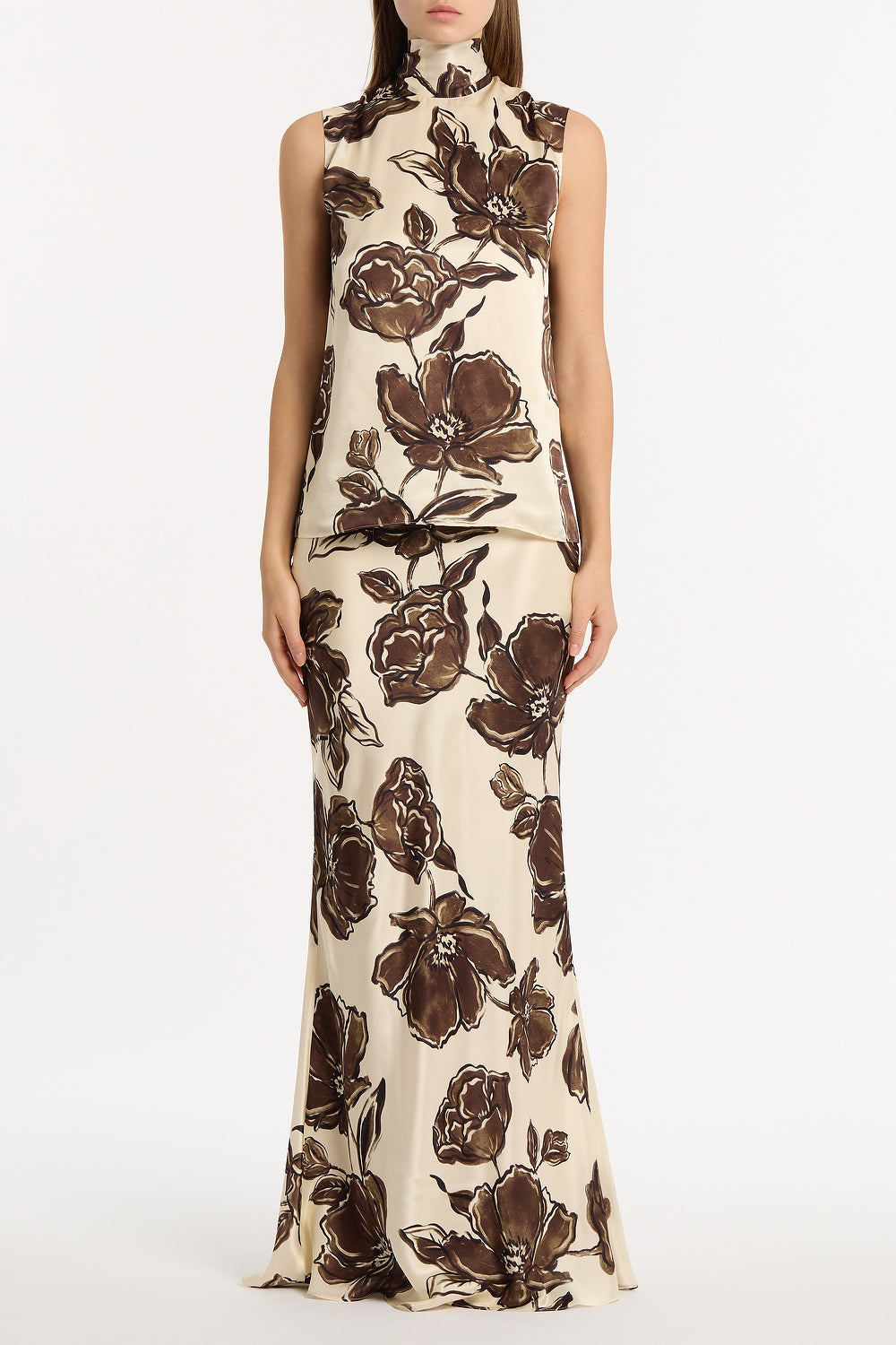 Image of a model wearing Skirts. Product name - Mocha Bouquet Silk Viscose Bias Fishtail Skirt in Brown colour by brand - Carla Zampatti