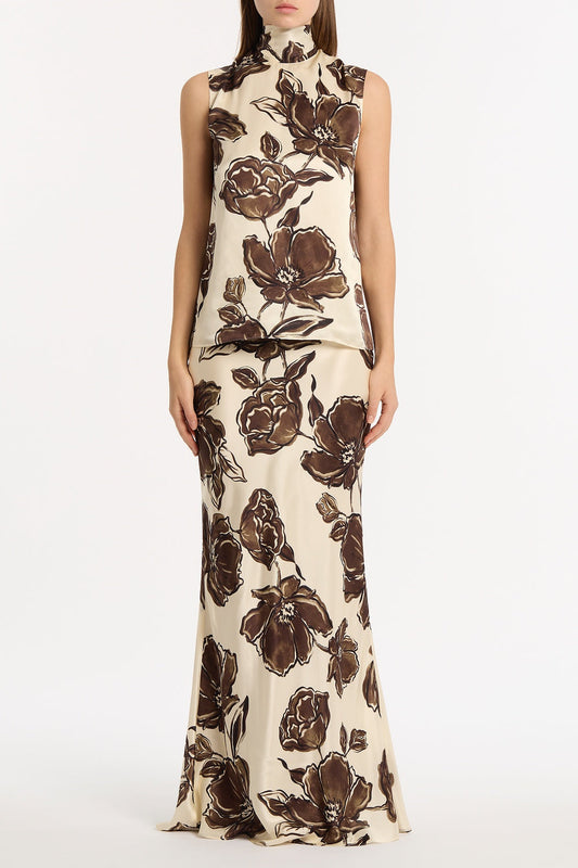 Image of a model wearing Tops. Product name - Mocha Bouquet Silk Viscose Tie Neck Top in Brown colour by brand - Carla Zampatti