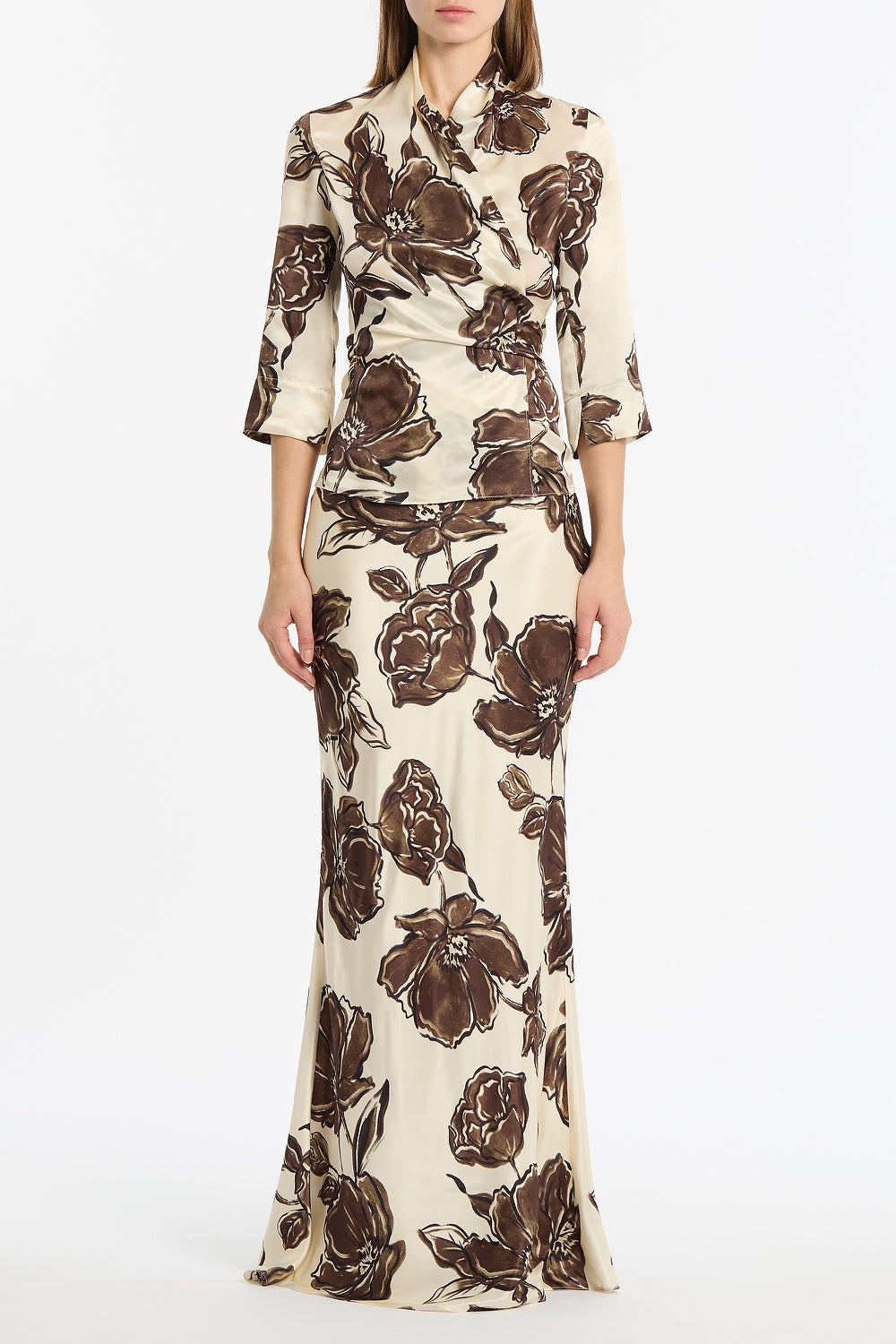 Image of a model wearing Tops. Product name - Mocha Bouquet Silk Viscose Wrap Top in Brown colour by brand - Carla Zampatti