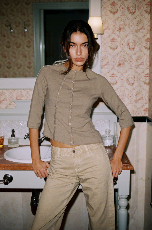 Image of a model wearing Tops. Product name - Monet Top in Olive colour by brand - With Jéan