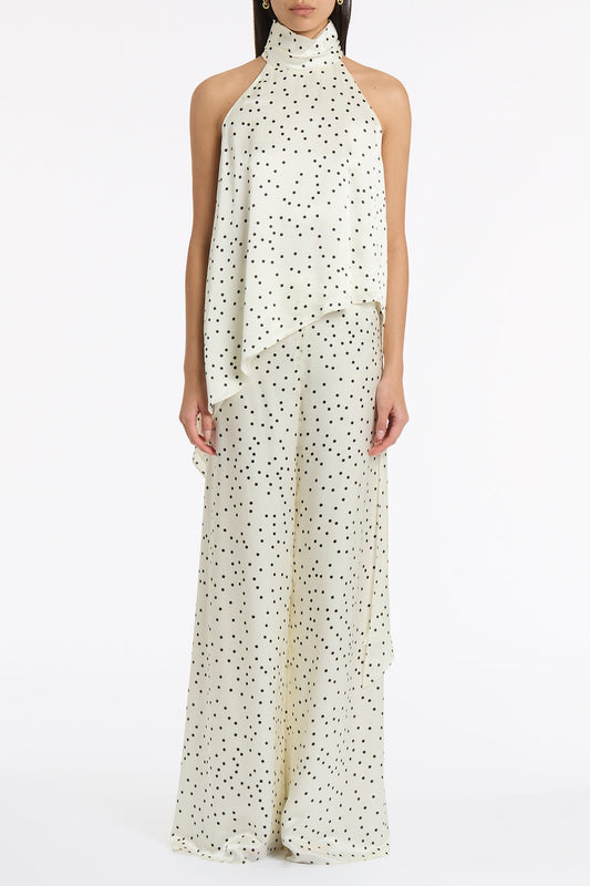 Image of a model wearing Tops. Product name - Monochrome Dot Silk Viscose Draped Asymmetric Top in Ivory colour by brand - Carla Zampatti