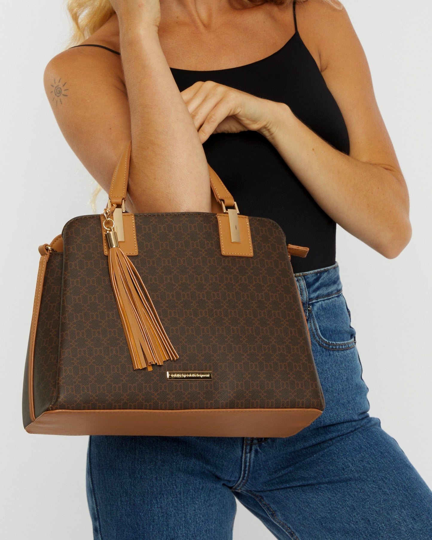 Image of Tote Bags. Productname: Monogram Toni Tassel Tote Bag in Monogram colour by brand - Colette by Colette Hayman