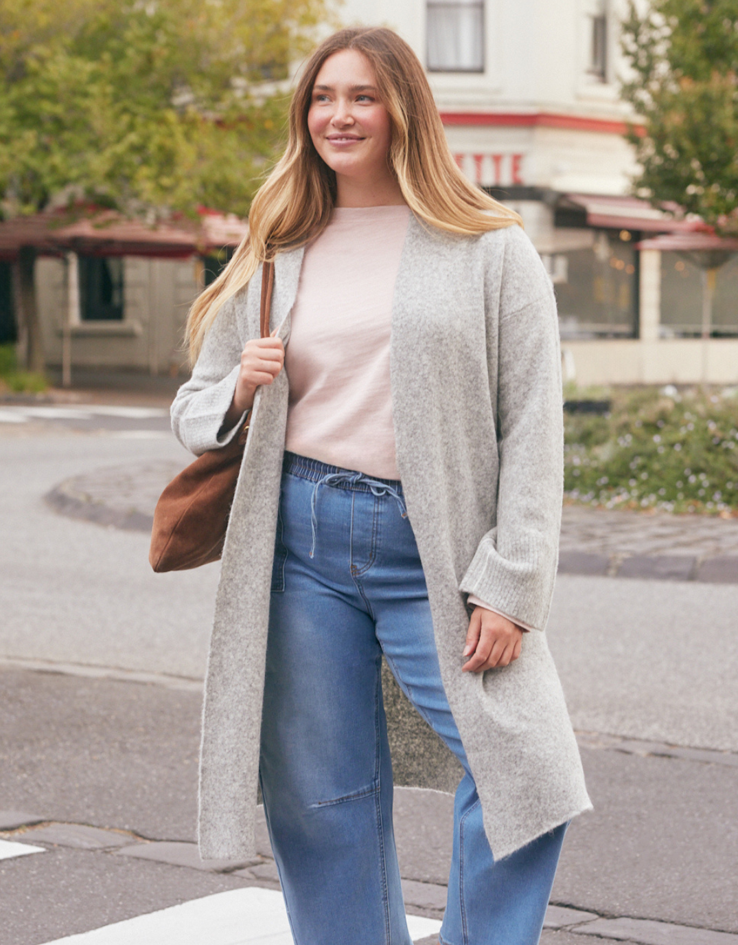 Image of a model wearing Outerwear. Product name - Montreux Wool Alpaca Longline Cardigan Grey Marle in Grey Marle colour by brand - White & Co.