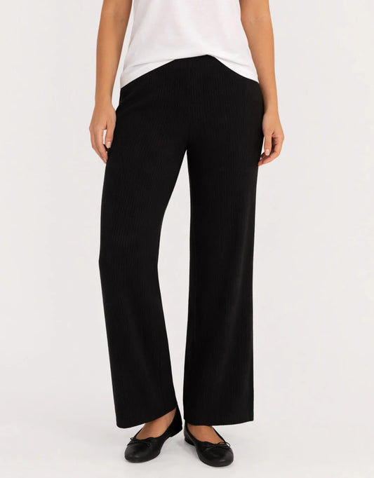Image of a model wearing Pants. Product name - Nash Knit Pant Black in Black colour by brand - Betty Basics