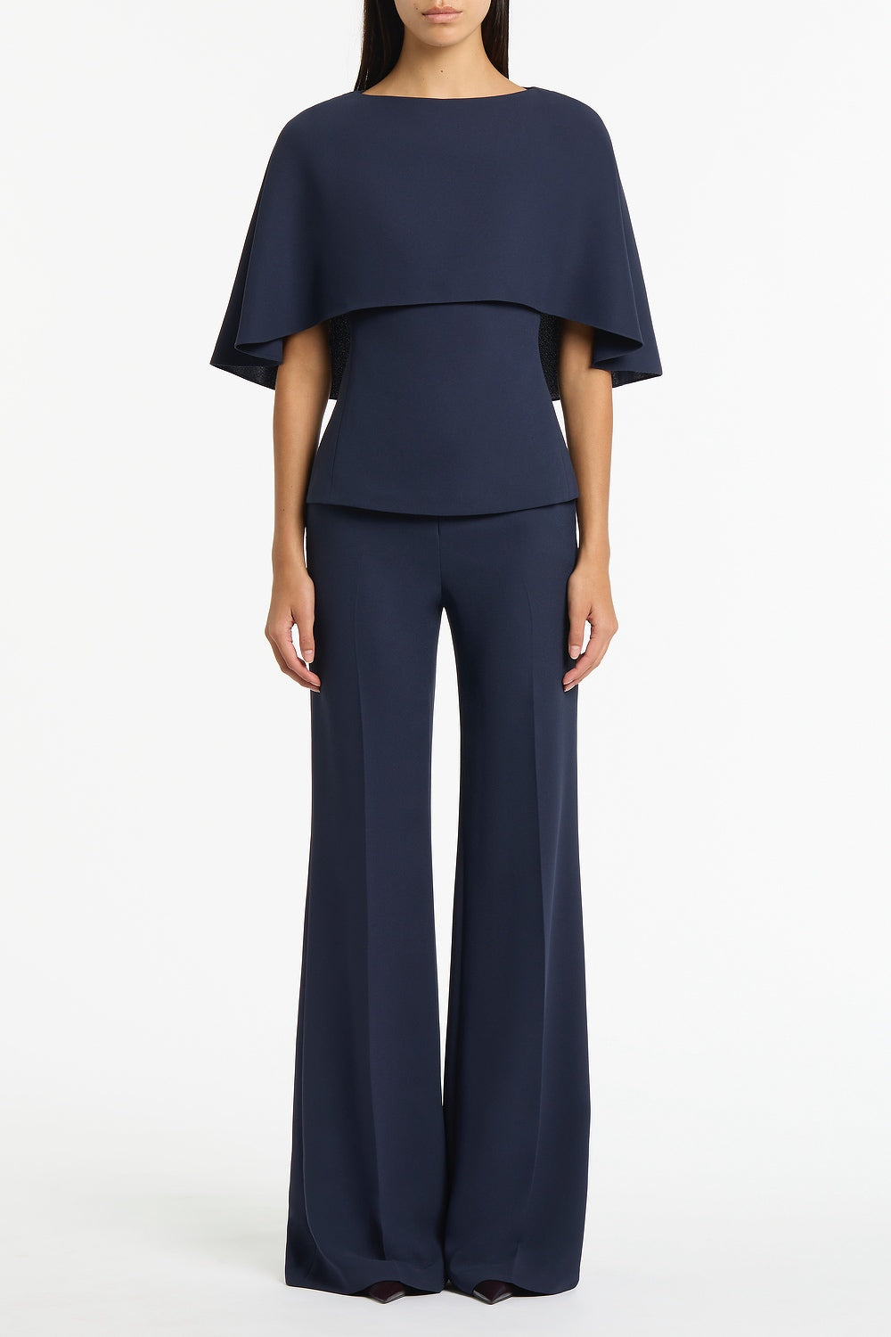 Image of a model wearing Tops. Product name - Navy Crepe Cape Top in Navy colour by brand - Carla Zampatti