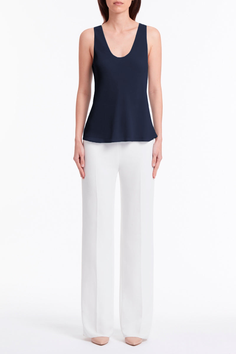 Image of a model wearing Tops. Product name - Navy Georgette Scoop Cami in Navy colour by brand - Carla Zampatti