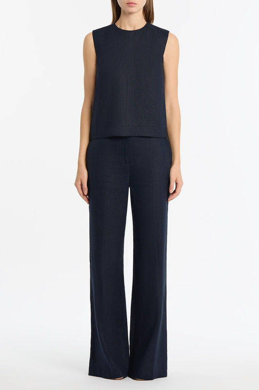 Image of a model wearing Tops. Product name - Navy Linen Tank Top in Navy colour by brand - Carla Zampatti