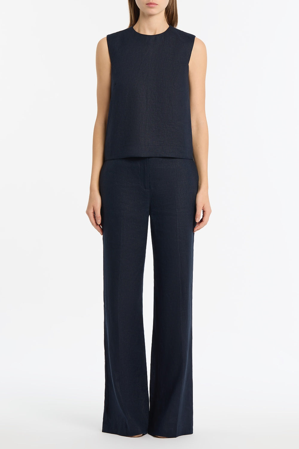 Image of a model wearing Pants. Product name - Navy Linen Waisted Pant in Navy colour by brand - Carla Zampatti