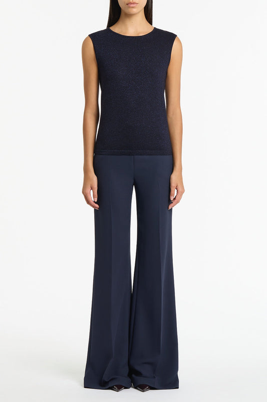 Image of a model wearing Tops. Product name - Navy Metallic Knit Cap Sleeve Top in Navy colour by brand - Carla Zampatti