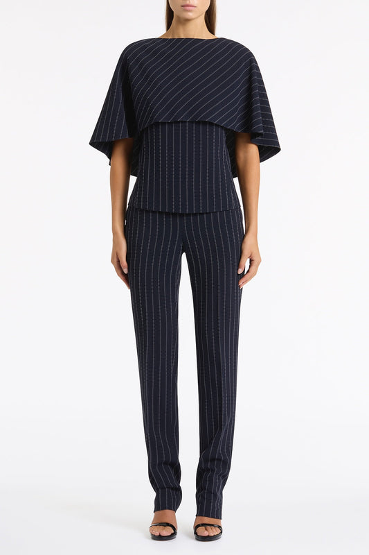 Image of a model wearing Pants. Product name - Navy Pinstripe Slim Leg Pant in Navy colour by brand - Carla Zampatti