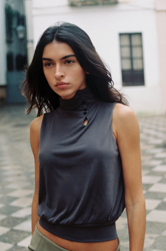 Image of a model wearing Tops. Product name - Nova Top in Charcoal colour by brand - With Jéan