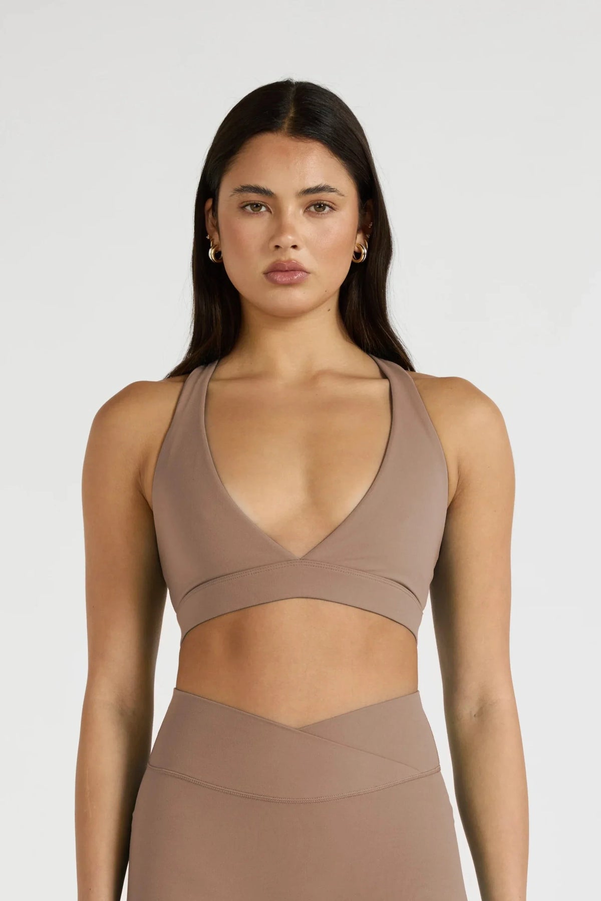 Image of Activewear. Product name - ALLFENIX CloudCore Deep V-Neck Sports Bra in Latte colour by brand - All Fenix