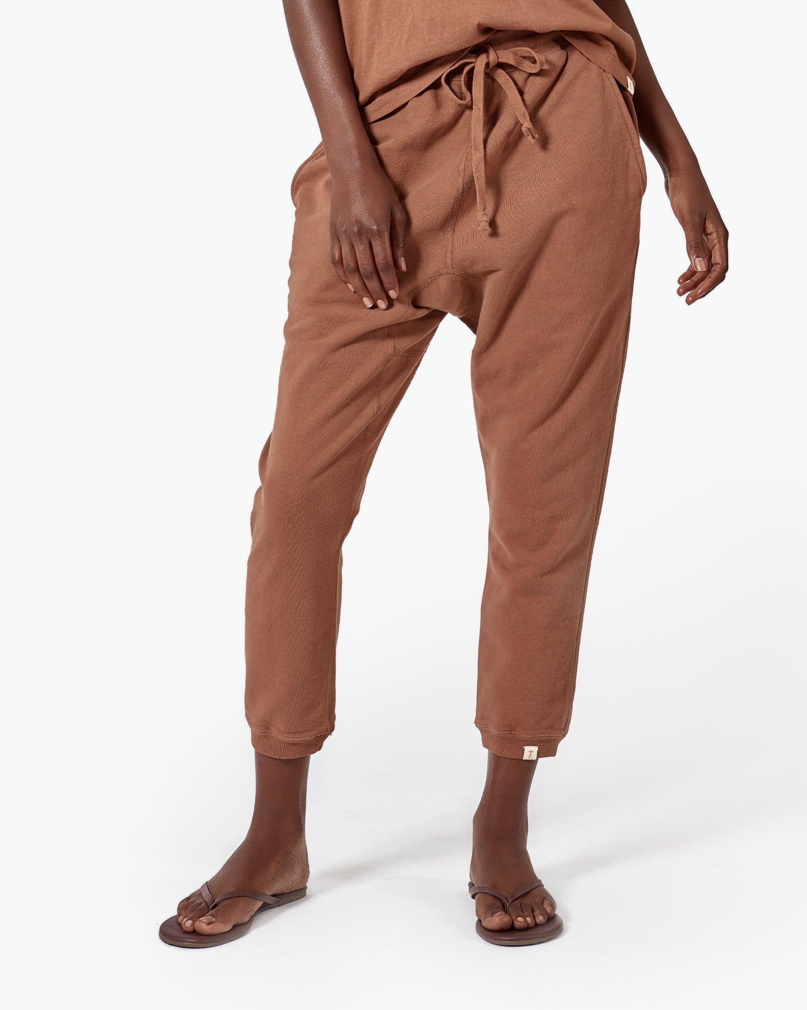 Image of a model wearing Pants. Productname: Core Jogger Nutmeg in Nutmeg colour by brand - TKEES