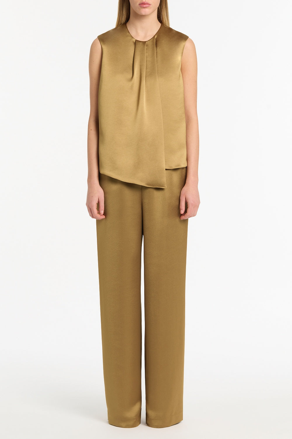 Image of a model wearing Pants. Product name - Old Gold Lustre Satin Elastic Pant in Gold colour by brand - Carla Zampatti
