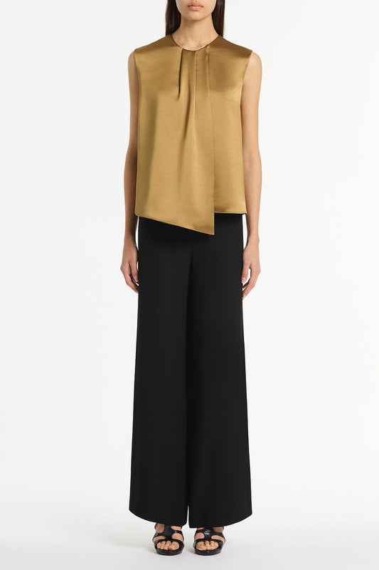 Image of a model wearing Tops. Product name - Old Gold Lustre Satin Tuck Front Top in Gold colour by brand - Carla Zampatti