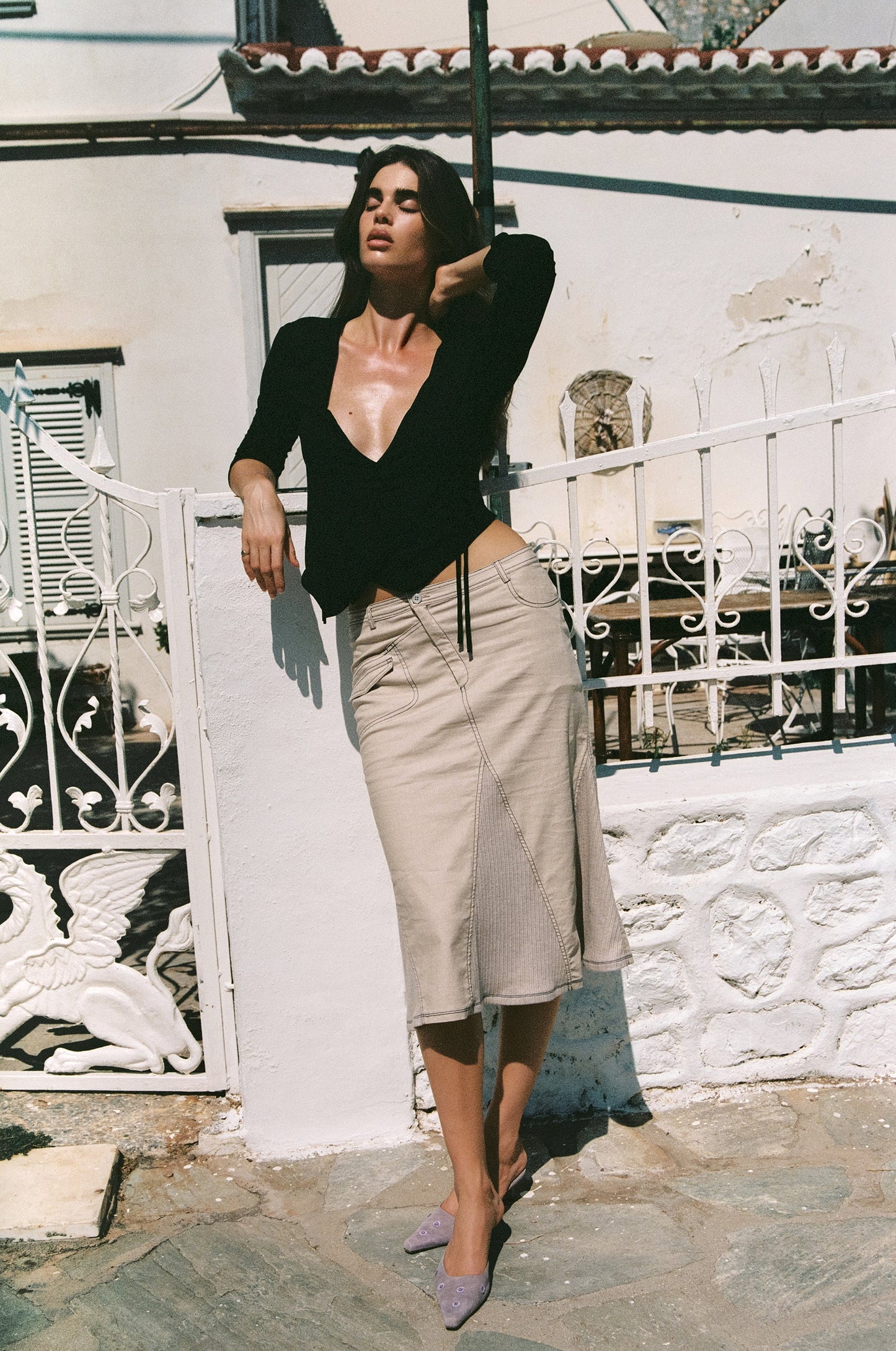 Image of a model wearing Skirts. Product name - Ondine Skirt in Taupe colour by brand - With Jéan