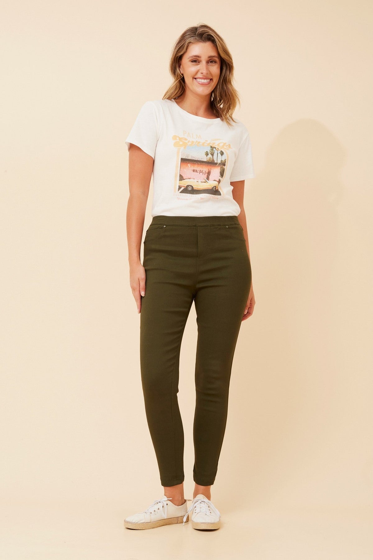 Image of a model wearing Pants. Product name - PRESLEY SKINNY PANTS in Black colour by brand - Caroline Morgan Australia