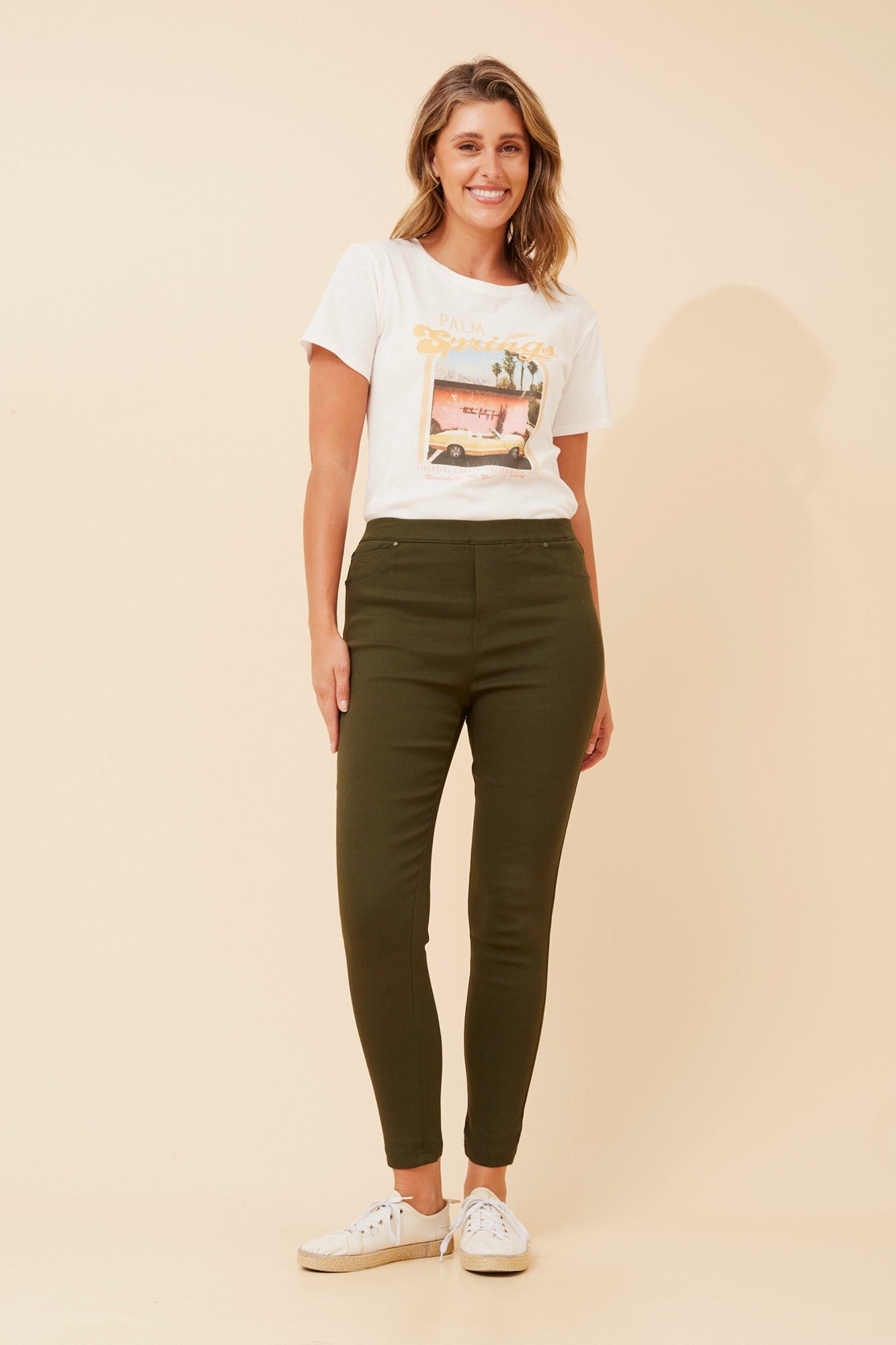 Image of a model wearing Pants. Product name - PRESLEY SKINNY PANTS in Black colour by brand - Caroline Morgan Australia