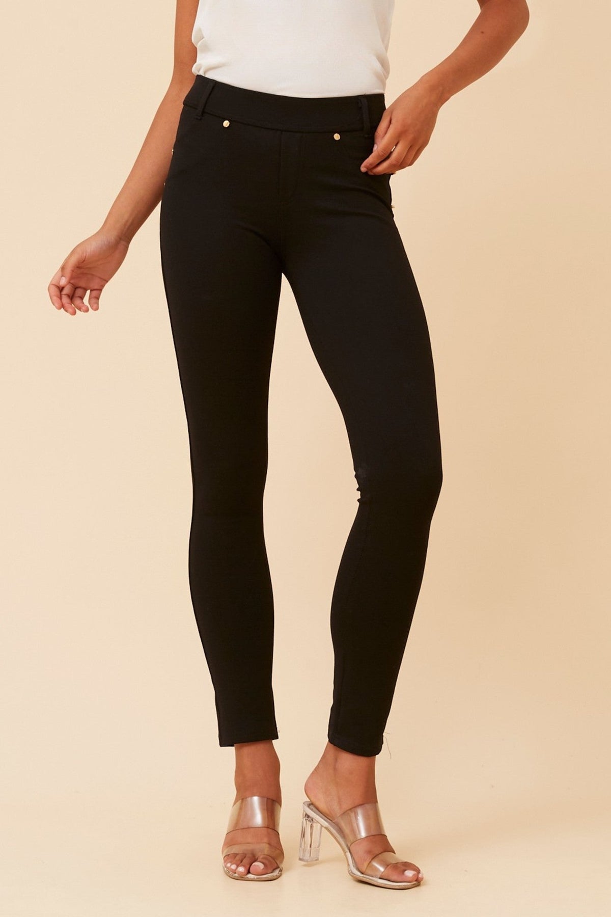Image of a model wearing Pants. Product name - COMET SOLID PANTS in Black colour by brand - Caroline Morgan Australia