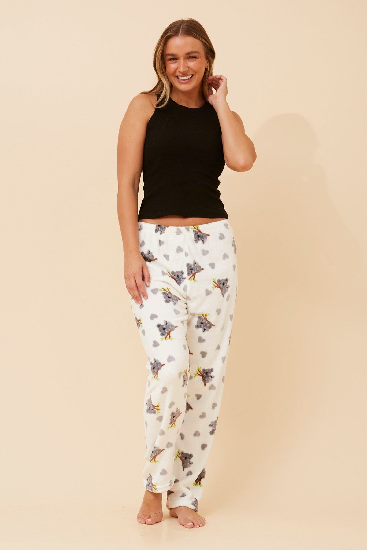 Image of a model wearing Pants. Product name - LEE KOALA PRINT PLUSH PYJAMA PANTS in Multi White colour by brand - Caroline Morgan Australia