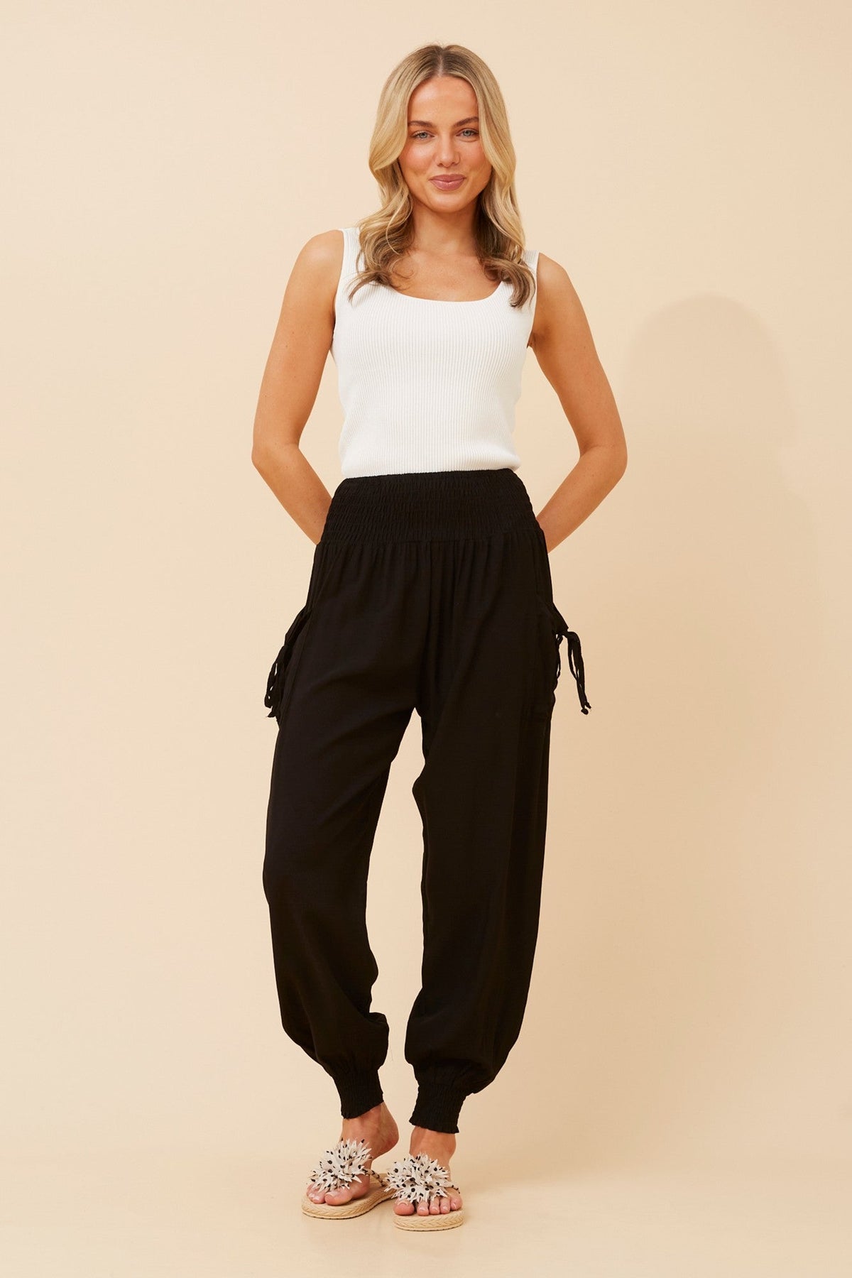 Image of a model wearing Pants. Product name - SOLID HAREM PANTS in Slate colour by brand - Caroline Morgan Australia