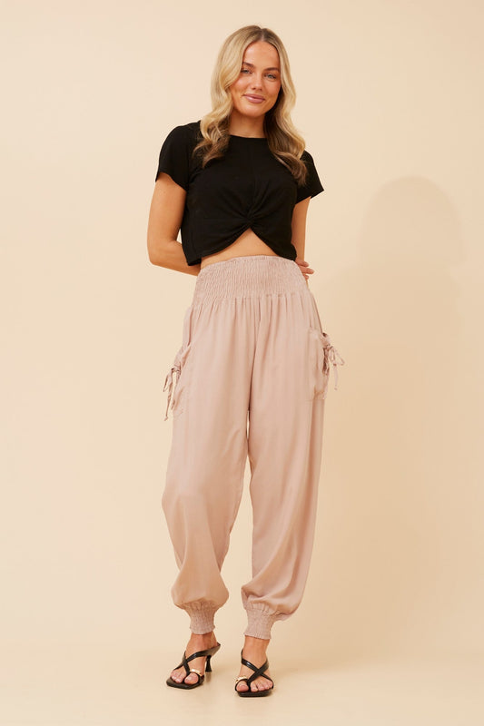 Image of a model wearing Pants. Product name - SOLID HAREM PANTS in Slate colour by brand - Caroline Morgan Australia