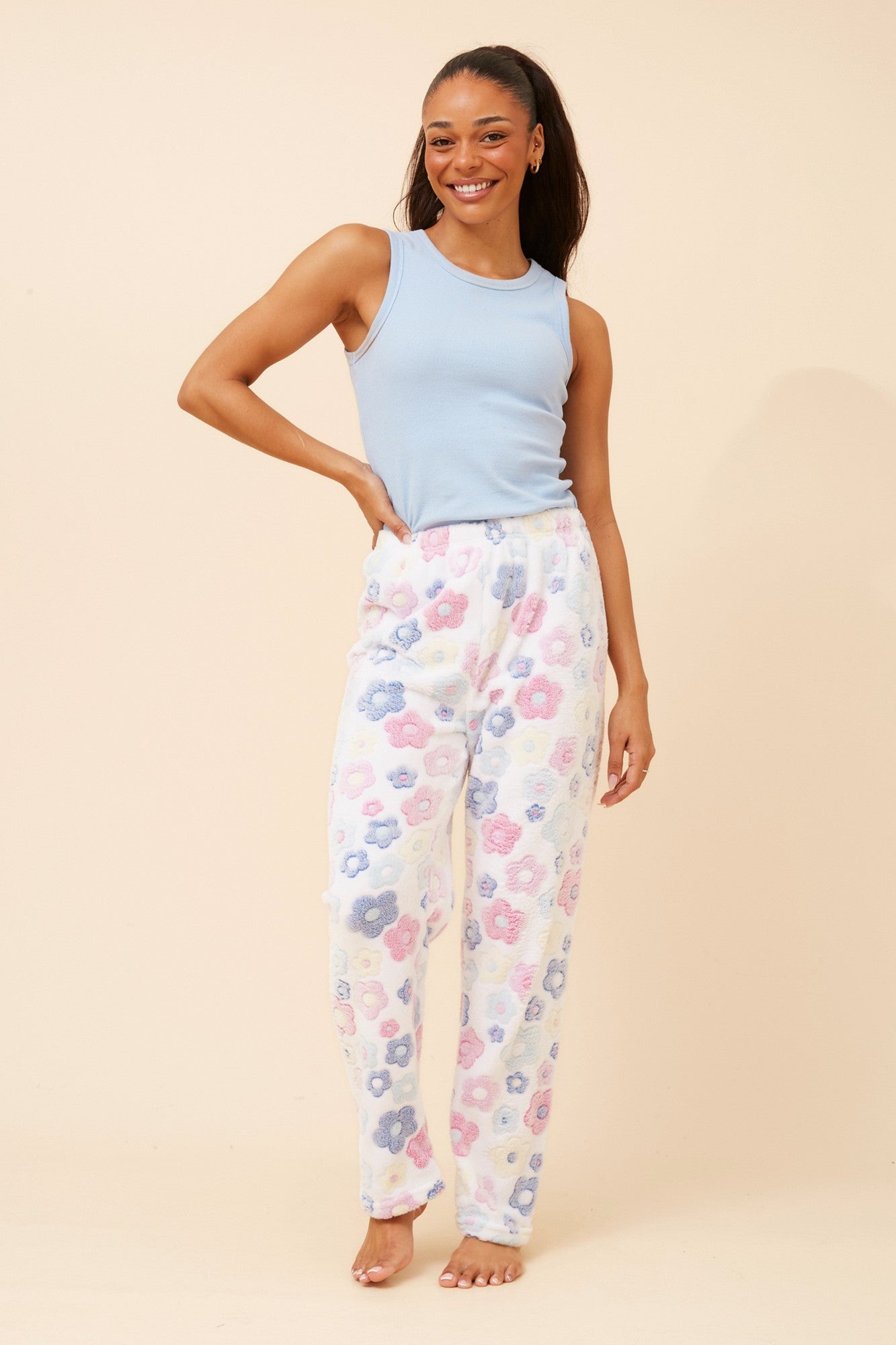 Image of a model wearing Pants. Product name - LEE FLORAL PRINT PYJAMA PANTS in Multi White colour by brand - Caroline Morgan Australia