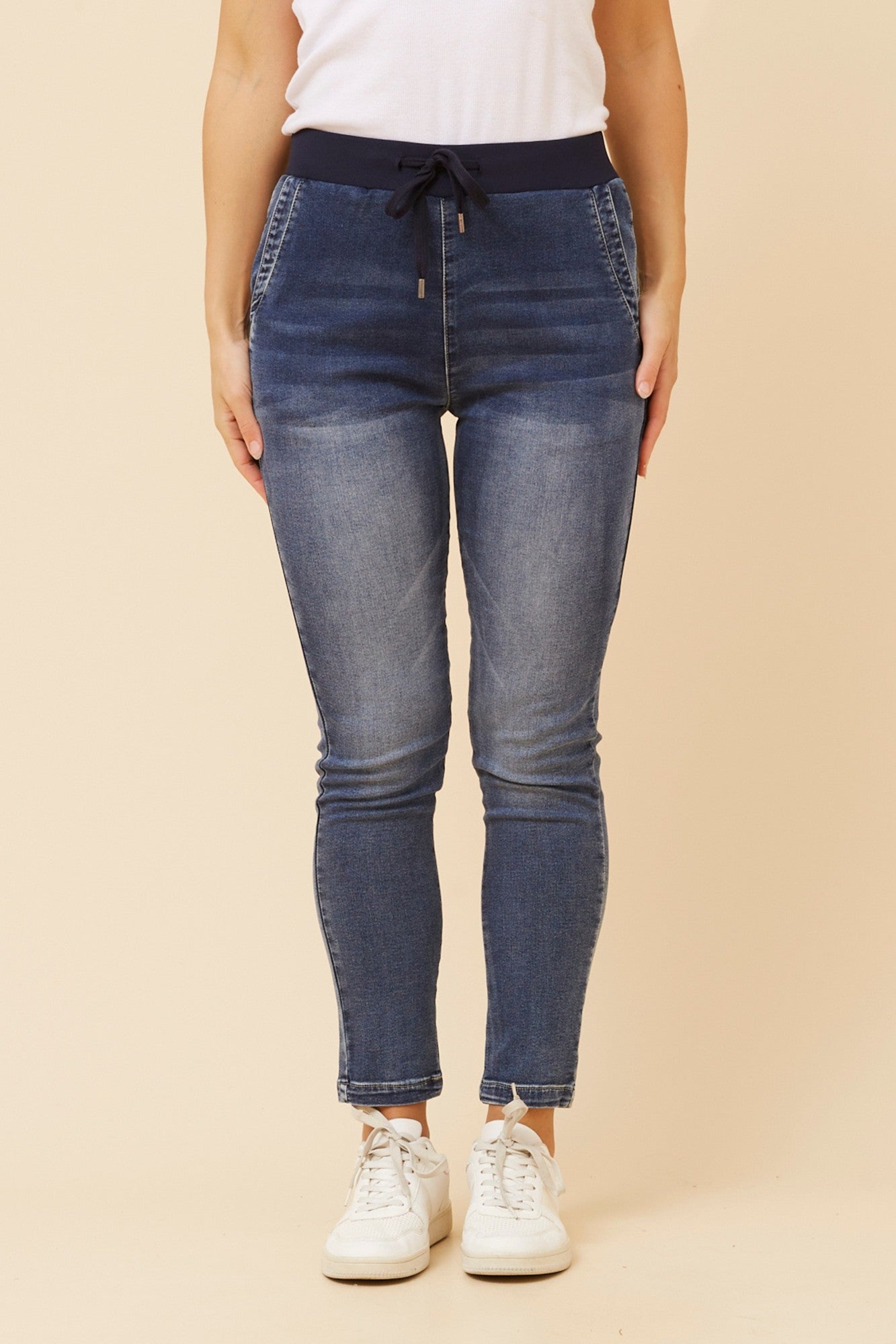 Image of a model wearing Pants. Product name - JILL DENIM JOGGER PANTS in Denim colour by brand - INFINITY DENIM