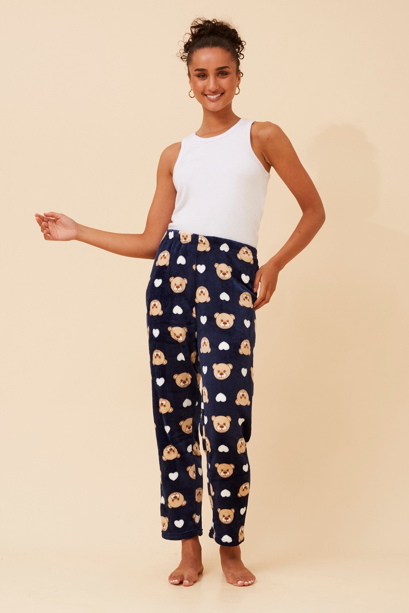 Image of a model wearing Pants. Product name - LEE TEDDY PRINT PLUSH PYJAMA PANTS in Light Blue colour by brand - Caroline Morgan Australia