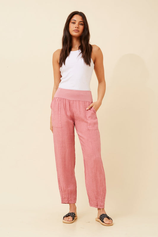 Image of a model wearing Pants. Product name - FINN SOLID LINEN PANTS in Cipolla colour by brand - BOTTEGA MODA